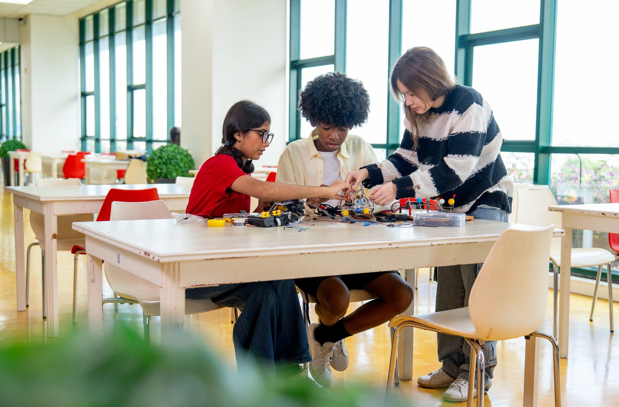 Older children exploring STEM building activities