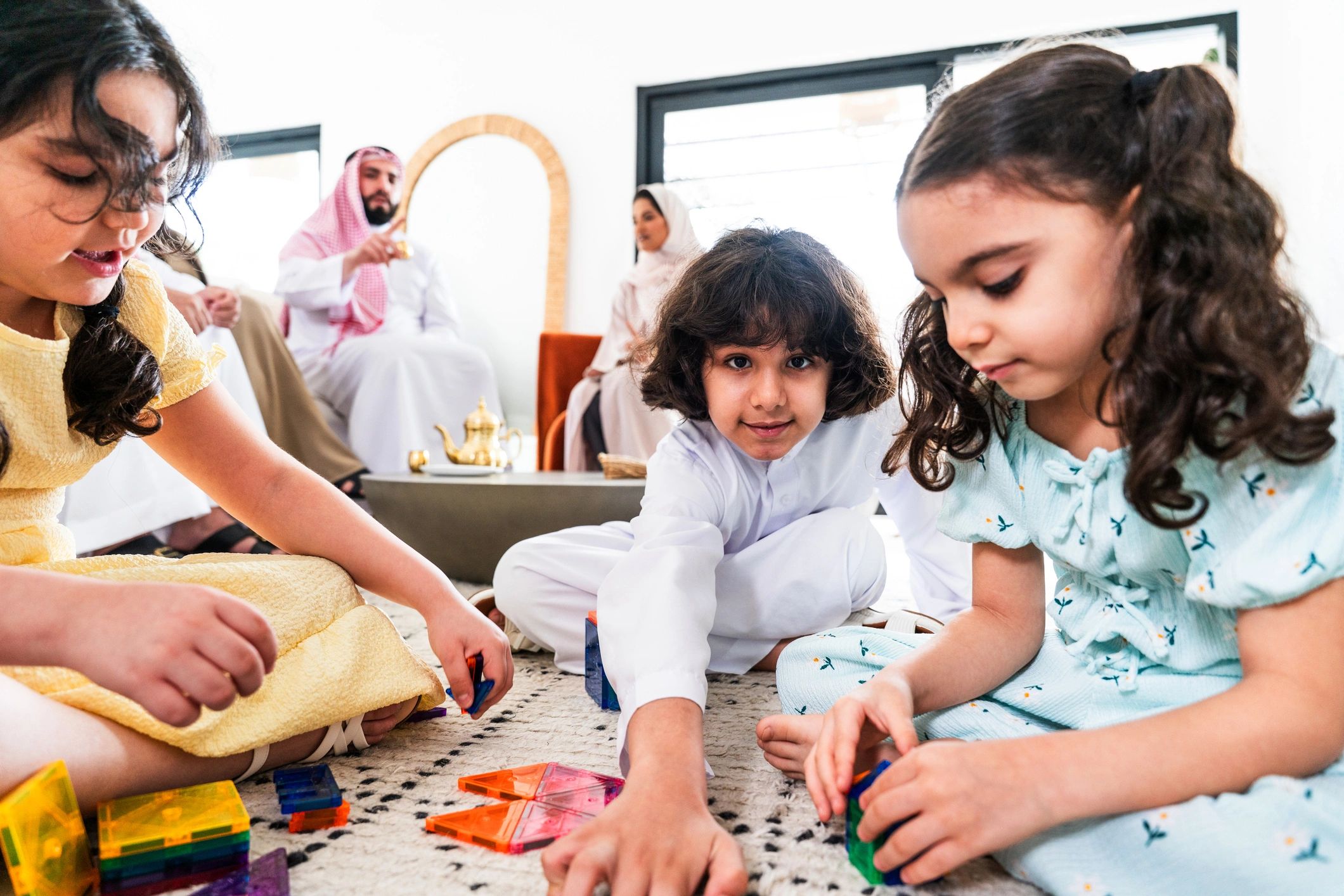 Children enjoying magnetic construction play